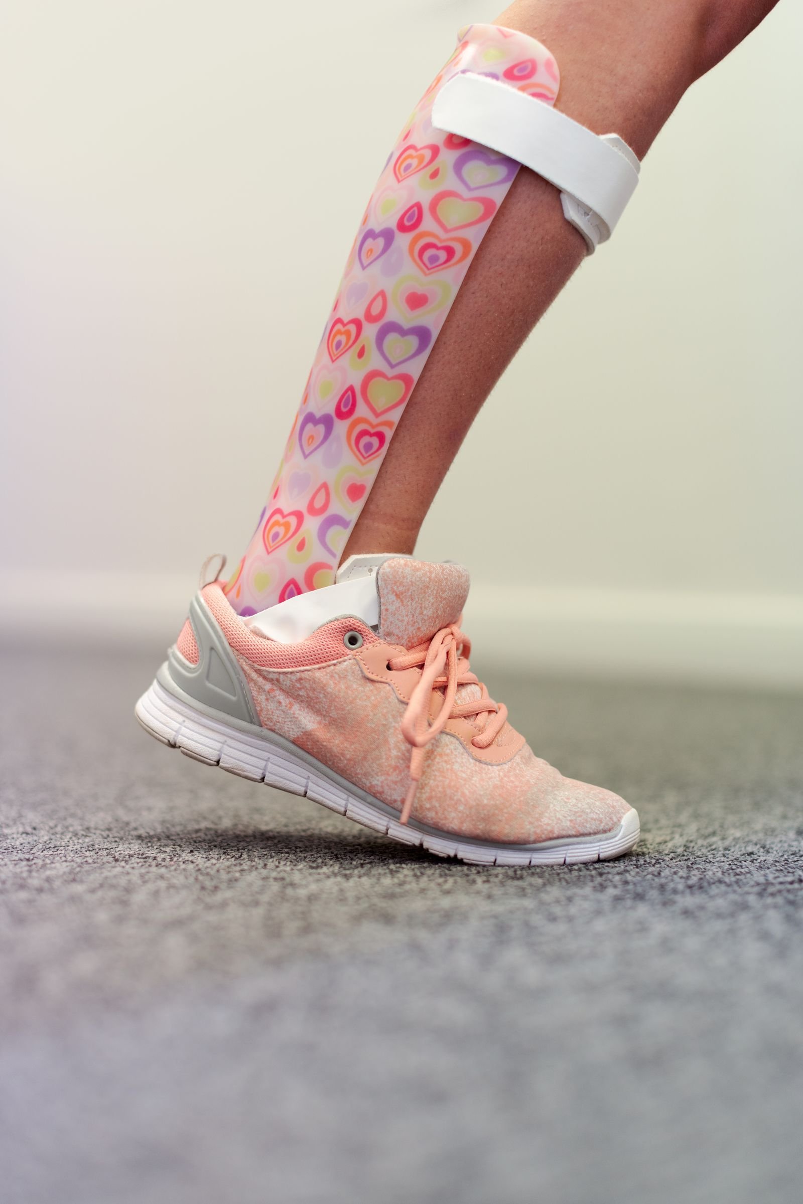 Close view of an ankle-foot orthosis worn inside a shoe.